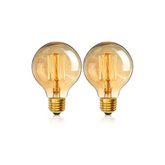 Two vintage-style light bulbs with gold bases on a white background